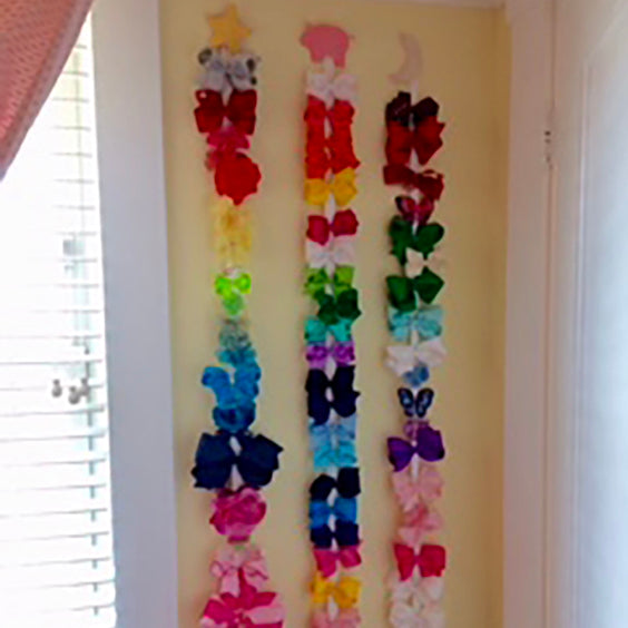 Wee One's bows hanging on the wall